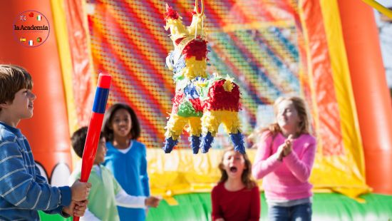 A group of children gathered around a multi-coloured donkey shaped pinata